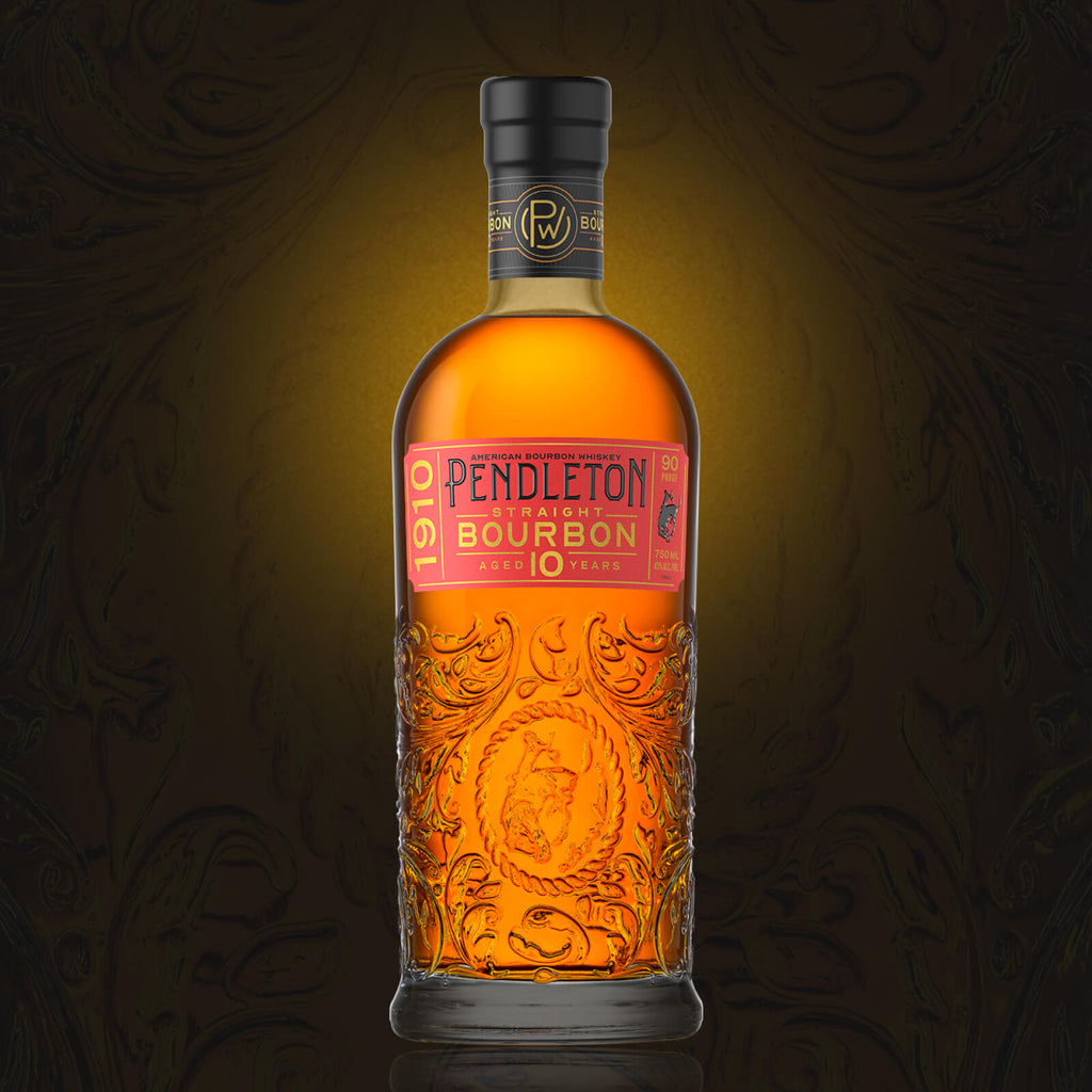 A bottle of Pendleton 1910 Straight Bourbon Whiskey. It's a 10-year-old bourbon with a gold and red label featuring intricate designs.