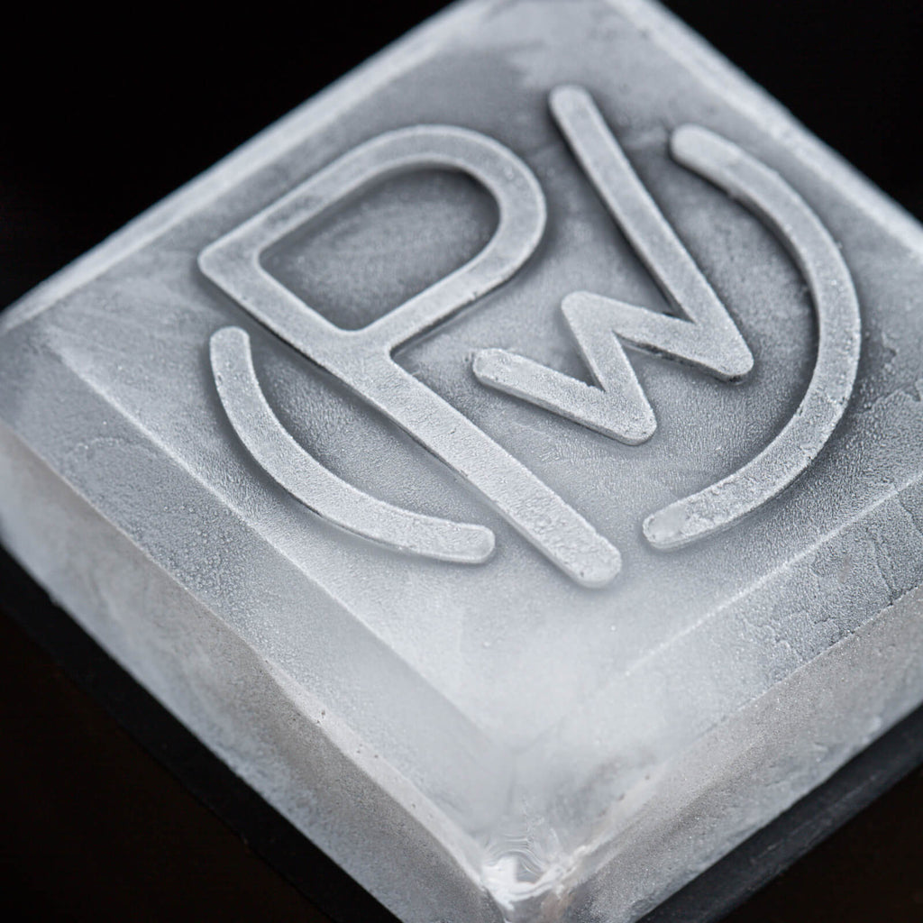 Closeup of ice cube with Pendleton® Whisky logo on the top of it